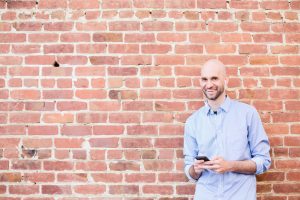 Nick Loper headshot brick wall