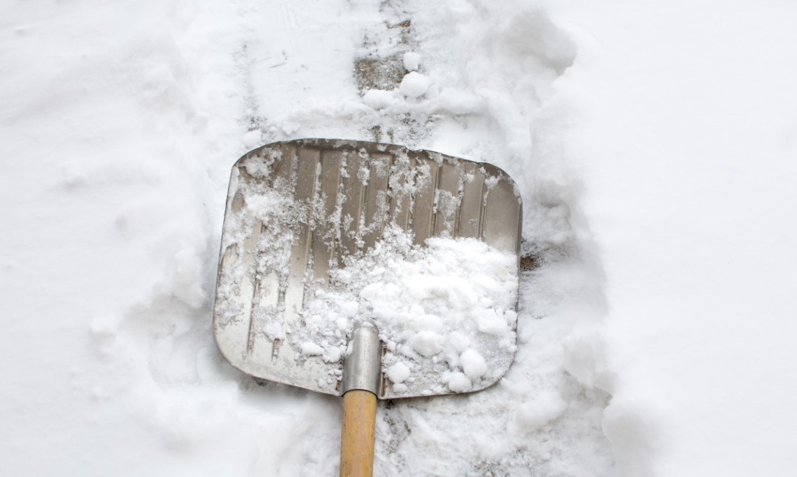 snow shovel doing snow removal